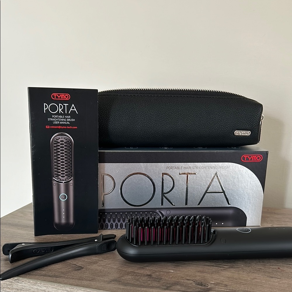 Black Grooming Tool with Heated Brush Design and Multiple Bristles